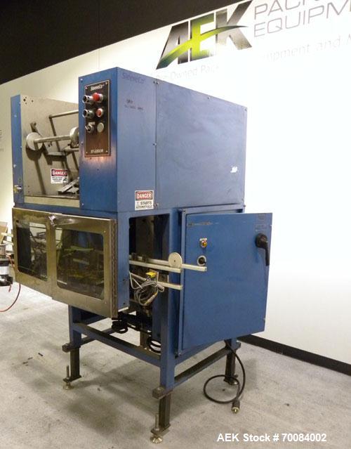 Used SleeveCo Model ST-2200R Stretch Sleeve Applicator capable of speeds up to 60 bottles per minute. Currently set up on round gallon containers, has film registration. Machine footprint 48" long x ...