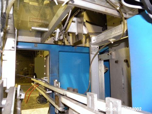 Used SleeveCo Model ST-2200R Stretch Sleeve Applicator capable of speeds up to 60 bottles per minute. Currently set up on round gallon containers, has film registration. Machine footprint 48" long x ...