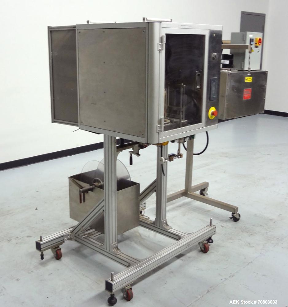 Used TriPack LSA-160 Automatic Shrink Sleeve Labeler Applicator / Neck Bander. Capable of speeds up to 100 BPM. Layflat width 40mm-170mm. Product Diameter 1" to 4.5". Cut off length 30mm-200mm. Thick...