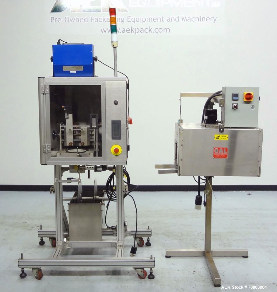 Used TriPack LSA-160 Automatic Shrink Sleeve Labeler Applicator / Neck Bander. Capable of speeds up to 100 BPM. Layflat width 40mm-170mm. Product Diameter 1" to 4.25". Cut off length 30mm-200mm. Thic...