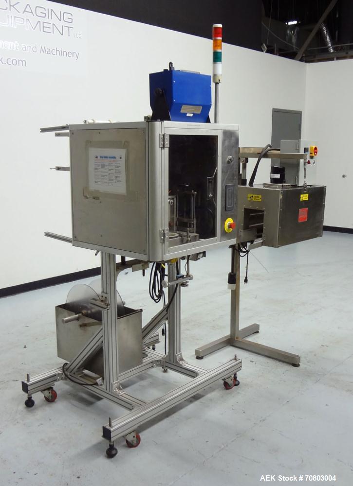 Used TriPack LSA-160 Automatic Shrink Sleeve Labeler Applicator / Neck Bander. Capable of speeds up to 100 BPM. Layflat width 40mm-170mm. Product Diameter 1" to 4.25". Cut off length 30mm-200mm. Thic...