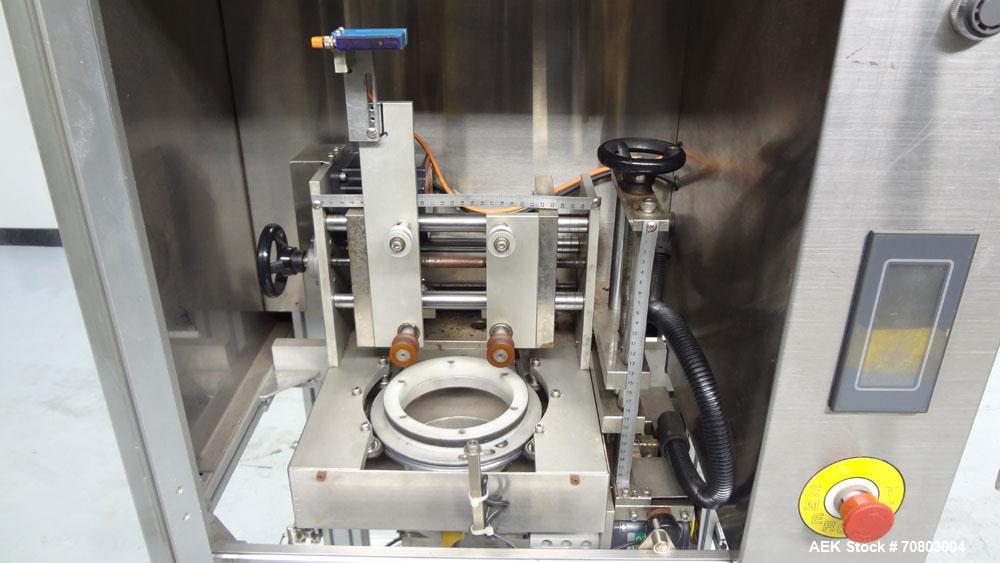 Used TriPack LSA-160 Automatic Shrink Sleeve Labeler Applicator / Neck Bander. Capable of speeds up to 100 BPM. Layflat width 40mm-170mm. Product Diameter 1" to 4.25". Cut off length 30mm-200mm. Thic...