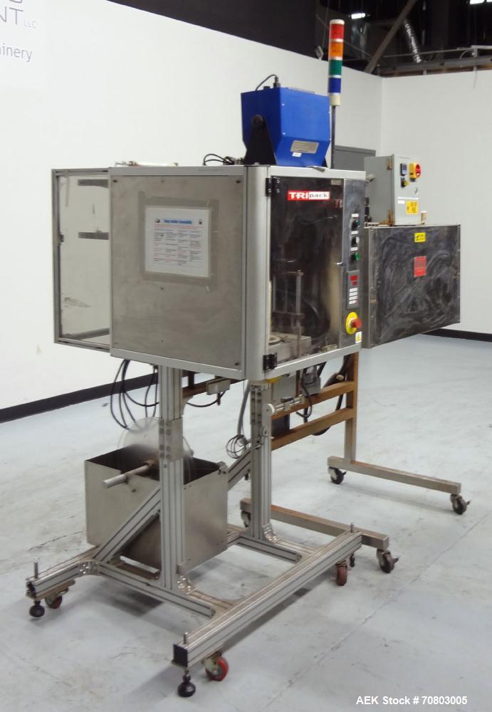 Used TriPack LSA-160 Automatic Shrink Sleeve Labeler Applicator / Neck Bander. Capable of speeds up to 100 BPM. Layflat width 40mm-170mm. Product Diameter 1" to 4.25". Cut off length 30mm-200mm. Thic...