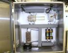 Used Axon Corporation EZ-100 Tamper Evident Band and Sleeve Label Applicator capable of speeds up to 150 packages per minute. Stainless steel design. Has vertical perforation, power unwind station an...