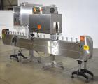 Used Axon Styrotech EZ-Seal EZ-200 Single Head Tamper Evident Neck Bander. Designed to run up to 120 containers per minute. 1-60/115 volt, 10 amp, serial # T-100210B, built 05/2010. Includes a heat s...