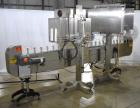 Used Axon Styrotech EZ-Seal EZ-200 Single Head Tamper Evident Neck Bander. Designed to run up to 120 containers per minute. 1-60/115 volt, 10 amp, serial # T-100210B, built 05/2010. Includes a heat s...