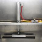 Used Axon Styrotech EZ-Seal EZ-200 Single Head Tamper Evident Neck Bander. Designed to run up to 120 containers per minute. 1-60/115 volt, 10 amp, serial # T-100210B, built 05/2010. Includes a heat s...