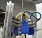 Used Axon Styrotech EZ-Seal EZ-200 Single Head Tamper Evident Neck Bander. Designed to run up to 120 containers per minute. 1-60/115 volt, 10 amp, serial # T-100210B, built 05/2010. Includes a heat s...