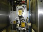 Used- Graham Packaging RF200LRSleeve Labeler. Capable of speeds up to 200 bottles per minute. Sleeve layflat range of 30mm -...