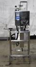 Used Marburg Industries Model M-725-FB Auto Cap Sealer. Approximate speeds up to 200 units per minute. Approximate bands up to a 70mm closure. Has Mitsubishi MELSEC PLC, Mitsubishi drive. Serial# 165...