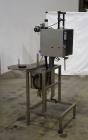 Used- Marburg Industries Model M-725-FB Auto Cap Sealer. Approximate speeds up to 200 units per minute. Approximate bands up...