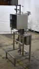Used Marburg Industries Model M-725-FB Auto Cap Sealer. Approximate speeds up to 200 units per minute. Approximate bands up to a 70mm closure. Has Mitsubishi MELSEC PLC, Mitsubishi drive. Serial# 165...