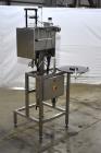 Used Marburg Industries Model M-725-FB Auto Cap Sealer. Approximate speeds up to 200 units per minute. Approximate bands up to a 70mm closure. Has Mitsubishi MELSEC PLC, Mitsubishi drive. Serial# 165...