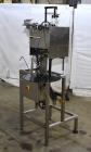 Used Marburg Industries Model M-725-FB Auto Cap Sealer. Approximate speeds up to 200 units per minute. Approximate bands up to a 70mm closure. Has Mitsubishi MELSEC PLC, Mitsubishi drive. Serial# 165...