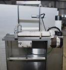 Used Marburg Industries Model M-725-FB Auto Cap Sealer. Approximate speeds up to 200 units per minute. Approximate bands up to a 70mm closure. Has Mitsubishi MELSEC PLC, Mitsubishi drive. Serial# 165...