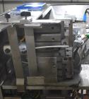 Used Marburg Industries Model M-725-FB Auto Cap Sealer. Approximate speeds up to 200 units per minute. Approximate bands up to a 70mm closure. Has Mitsubishi MELSEC PLC, Mitsubishi drive. Serial# 165...