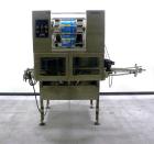 Used SleeveCo Automatic Sleeve Label Machine, Model SL-3000. Capable of speeds up to 50 containers per minute. Maximum size 2-1/2 gallon containers and currently set up on a one gallon round sleeve l...