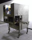 Used SleeveCo Automatic Sleeve Label Machine, Model SL-3000. Capable of speeds up to 50 containers per minute. Maximum size 2-1/2 gallon containers and currently set up on a one gallon round sleeve l...