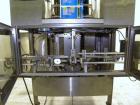 Used SleeveCo Automatic Sleeve Label Machine, Model SL-3000. Capable of speeds up to 50 containers per minute. Maximum size 2-1/2 gallon containers and currently set up on a one gallon round sleeve l...