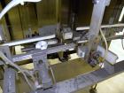 Used SleeveCo Automatic Sleeve Label Machine, Model SL-3000. Capable of speeds up to 50 containers per minute. Maximum size 2-1/2 gallon containers and currently set up on a one gallon round sleeve l...