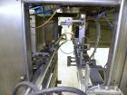 Used SleeveCo Automatic Sleeve Label Machine, Model SL-3000. Capable of speeds up to 50 containers per minute. Maximum size 2-1/2 gallon containers and currently set up on a one gallon round sleeve l...