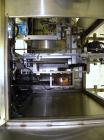 Used SleeveCo Automatic Sleeve Label Machine, Model SL-3000. Capable of speeds up to 50 containers per minute. Maximum size 2-1/2 gallon containers and currently set up on a one gallon round sleeve l...
