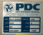 Used PDC Horizontal Shrink Sleeve Labeler, Model SLH-300ER, serial #016. Capable of speeds up to 350 ppm. Sleeve diameter range .325 to 2 inches (10 to 50 mm). Sleeve height range 1.25 to 7 inches (3...