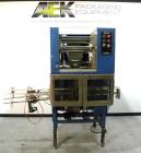 Used SleeveCo Model ST-2200R Stretch Sleeve Applicator capable of speeds up to 60 bottles per minute. Currently set up on round gallon containers, has film registration. Machine footprint 48