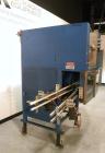 Used SleeveCo Model ST-2200R Stretch Sleeve Applicator capable of speeds up to 60 bottles per minute. Currently set up on round gallon containers, has film registration. Machine footprint 48