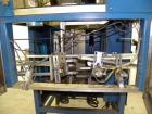 Used SleeveCo Model ST-2200R Stretch Sleeve Applicator capable of speeds up to 60 bottles per minute. Currently set up on round gallon containers, has film registration. Machine footprint 48