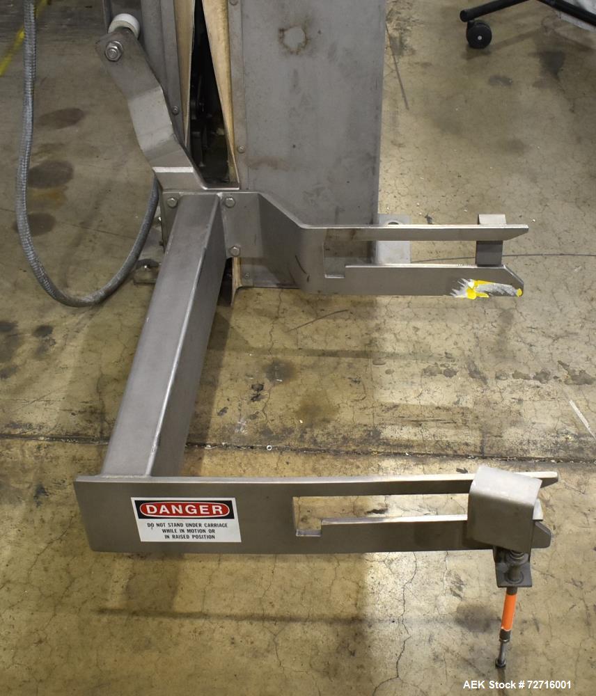 Used A-One Workhorse Single Column Dumper, Model CDL-600-71-S.  304 Stainless Steel construction, Dump Height: 86" Overall Column Height 102", Dump Angle: 35  2, Dump height set for use with 600 poun...