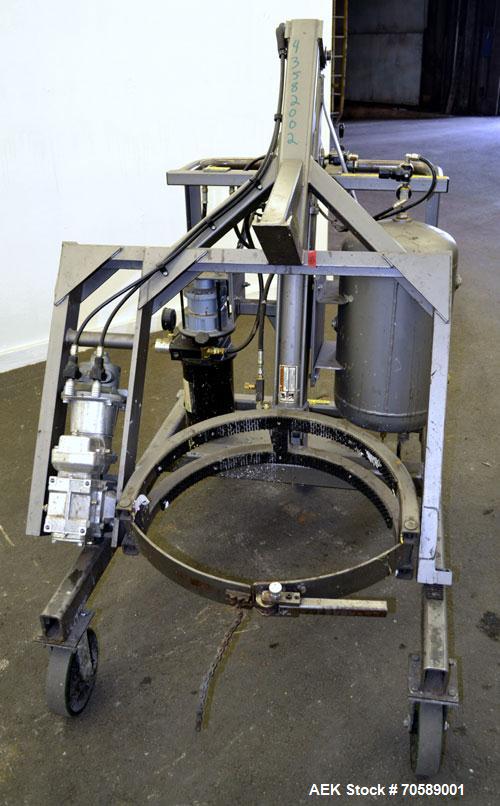 Used Drum Runner Material Handling Drum Lift-Carry-Rotate-Pour, Model 4600A-H, carbon steel, 800 pound drum capacity.  Air lift and tilt with holding tank.  Designed for plastic, steel, and fiber dru...