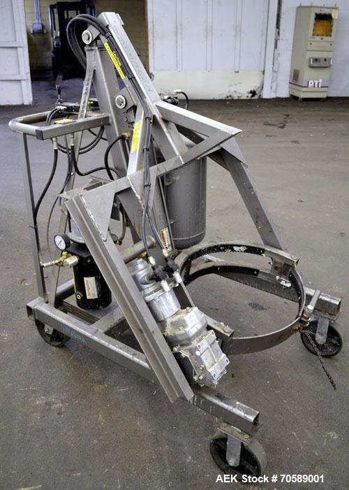 Used Drum Runner Material Handling Drum Lift-Carry-Rotate-Pour, Model 4600A-H, carbon steel, 800 pound drum capacity.  Air lift and tilt with holding tank.  Designed for plastic, steel, and fiber dru...
