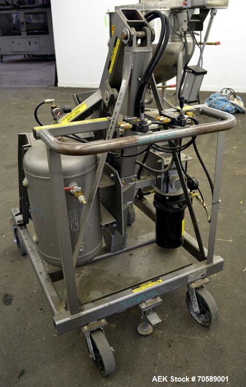 Used Drum Runner Material Handling Drum Lift-Carry-Rotate-Pour, Model 4600A-H, carbon steel, 800 pound drum capacity.  Air lift and tilt with holding tank.  Designed for plastic, steel, and fiber dru...