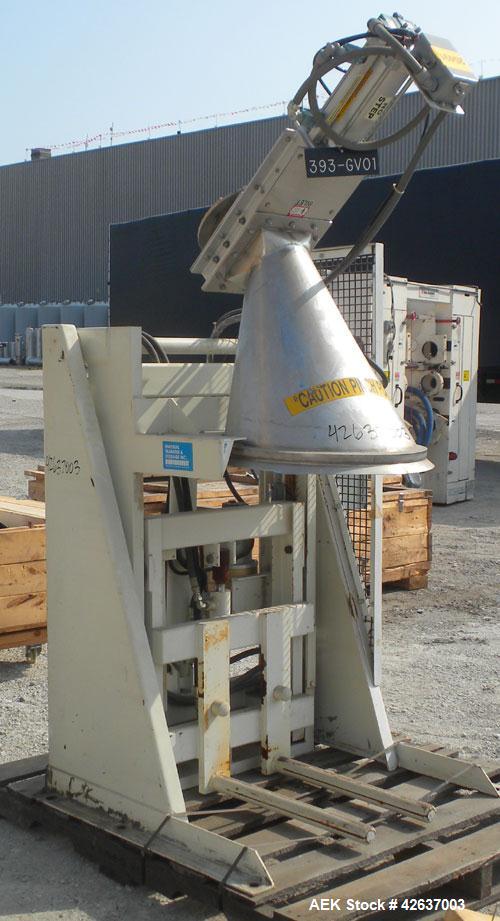 Used Material Transfer & Storage Lift and Dump Drum Discharger, Carbon Steel. 2 HP, 3/60/230/460 Volt, 1150 RPM hydraulic motor. 304 Stainless steel drum chute with a vortex air operated slide gate v...
