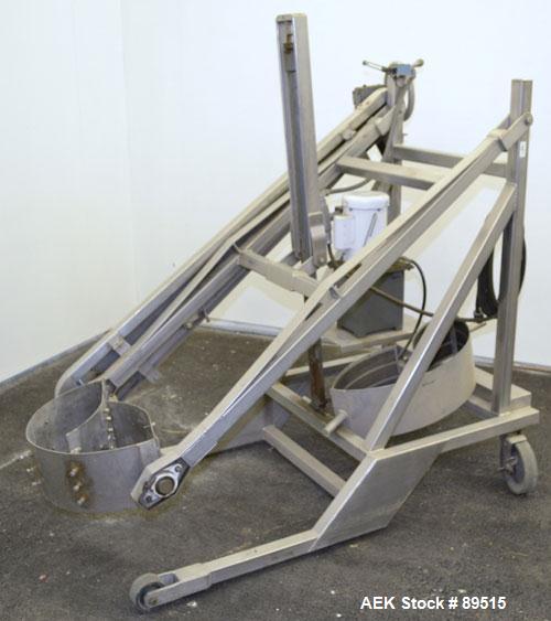 Used Sterling Fleischman Hydraulic Drum Dumper, 304 Stainless Steel. Approximate 750 pound capacity. 3/4 hp, 1/60/115/230 volt, 1725 rpm motor. Manual hand crank drum tilt. Unit mounted on casters.