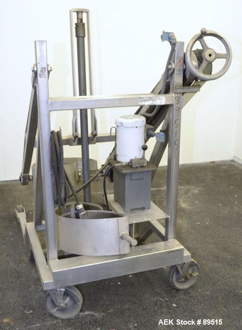 Used Sterling Fleischman Hydraulic Drum Dumper, 304 Stainless Steel. Approximate 750 pound capacity. 3/4 hp, 1/60/115/230 volt, 1725 rpm motor. Manual hand crank drum tilt. Unit mounted on casters.