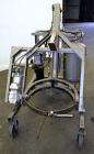 Used Drum Runner Material Handling Drum Lift-Carry-Rotate-Pour, Model 4600A-H, carbon steel, 800 pound drum capacity.  Air lift and tilt with holding tank.  Designed for plastic, steel, and fiber dru...