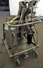 Used Drum Runner Material Handling Drum Lift-Carry-Rotate-Pour, Model 4600A-H, carbon steel, 800 pound drum capacity.  Air lift and tilt with holding tank.  Designed for plastic, steel, and fiber dru...
