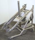 Used Sterling Fleischman Hydraulic Drum Dumper, 304 Stainless Steel. Approximate 750 pound capacity. 3/4 hp, 1/60/115/230 volt, 1725 rpm motor. Manual hand crank drum tilt. Unit mounted on casters.