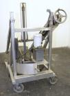 Used Sterling Fleischman Hydraulic Drum Dumper, 304 Stainless Steel. Approximate 750 pound capacity. 3/4 hp, 1/60/115/230 volt, 1725 rpm motor. Manual hand crank drum tilt. Unit mounted on casters.