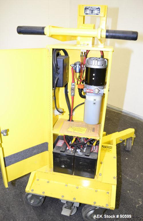 Used Easy Lift Equipment Drum Transporter, Model EL600DC, Carbon Steel. Battery operated, 600 pound capacity. Lift height 20", 1" per stroke. Mounted on casters.