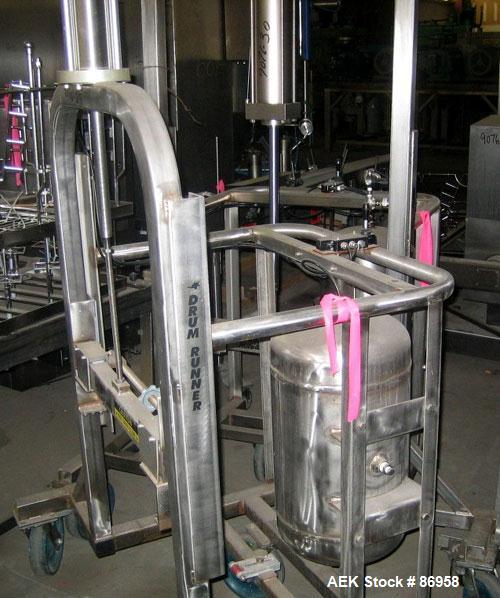 Used Material Handling Drum Runner, Model 5500 P/A, Stainless Steel. 1000 Pound drum capacity, air lift with tank. Drum height 29" to 36". Mounted on casters.