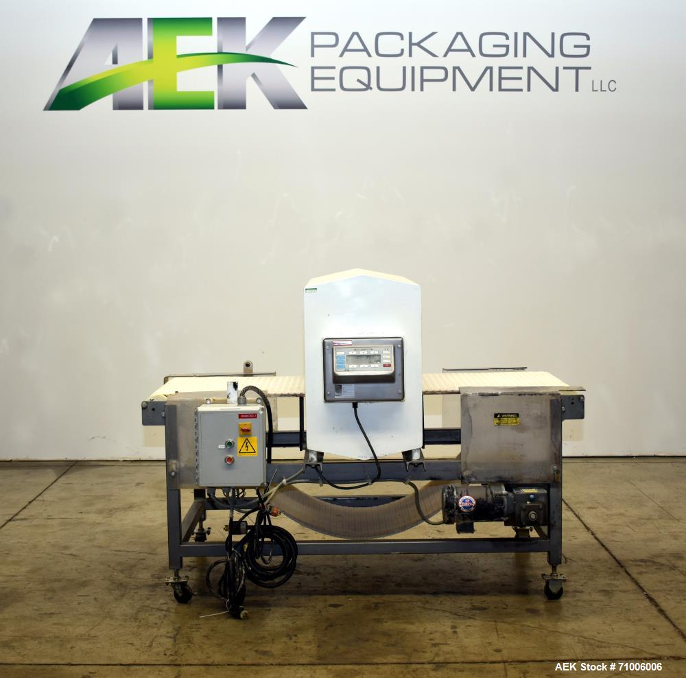 Used Goring Kerr Metal Detector, Model DSP2, 23.75" Wide x 11" high aperture. 22"Wide x 72" long plastic mattop conveyor. Stop belt reject. All stainless steel frame with casters.  3/60/208V (met Det...