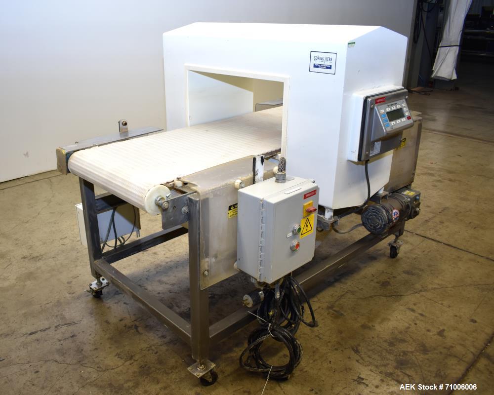 Used Goring Kerr Metal Detector, Model DSP2, 23.75" Wide x 11" high aperture. 22"Wide x 72" long plastic mattop conveyor. Stop belt reject. All stainless steel frame with casters.  3/60/208V (met Det...