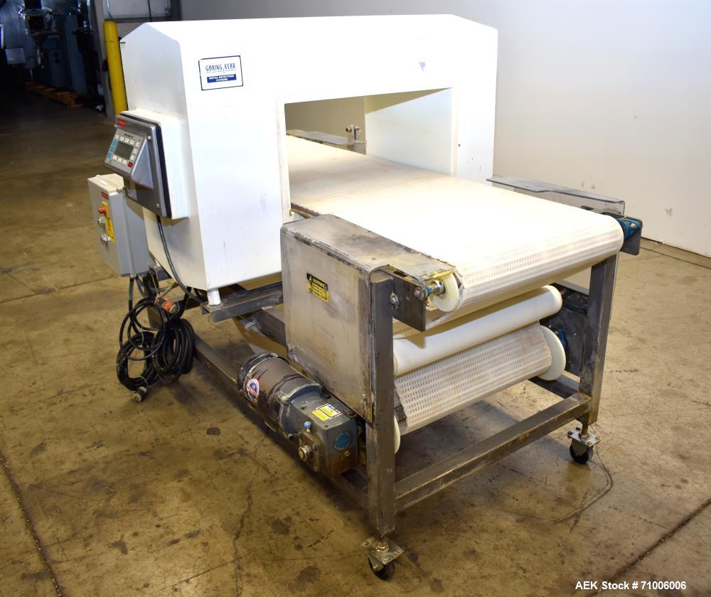 Used Goring Kerr Metal Detector, Model DSP2, 23.75" Wide x 11" high aperture. 22"Wide x 72" long plastic mattop conveyor. Stop belt reject. All stainless steel frame with casters.  3/60/208V (met Det...