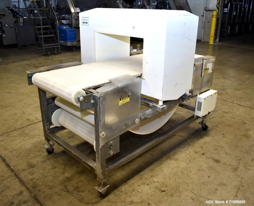 Used Goring Kerr Metal Detector, Model DSP2, 23.75" Wide x 11" high aperture. 22"Wide x 72" long plastic mattop conveyor. Stop belt reject. All stainless steel frame with casters.  3/60/208V (met Det...