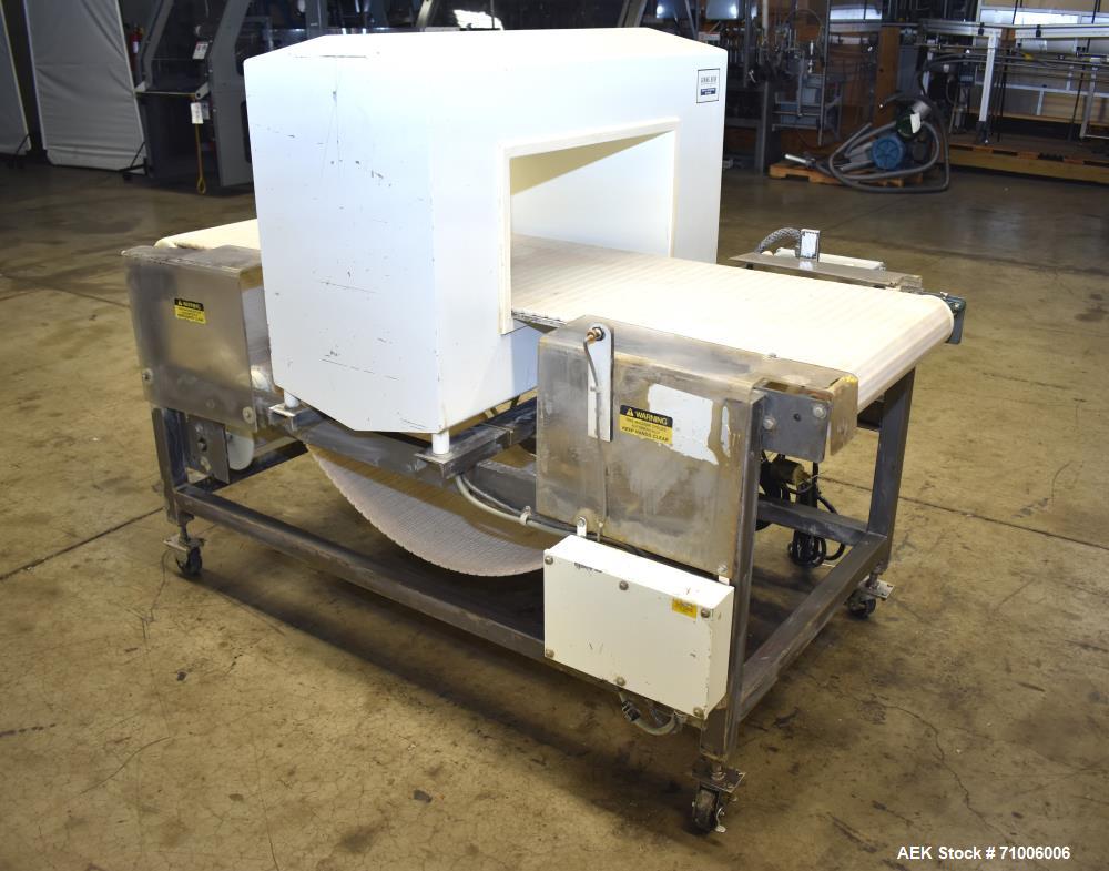 Used Goring Kerr Metal Detector, Model DSP2, 23.75" Wide x 11" high aperture. 22"Wide x 72" long plastic mattop conveyor. Stop belt reject. All stainless steel frame with casters.  3/60/208V (met Det...