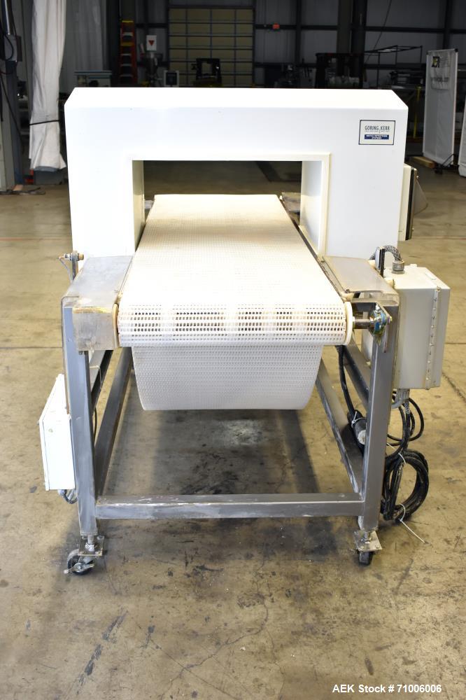 Used Goring Kerr Metal Detector, Model DSP2, 23.75" Wide x 11" high aperture. 22"Wide x 72" long plastic mattop conveyor. Stop belt reject. All stainless steel frame with casters.  3/60/208V (met Det...