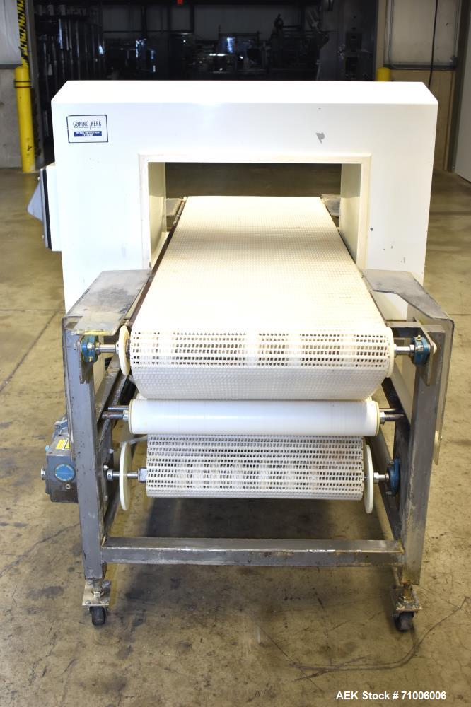 Used Goring Kerr Metal Detector, Model DSP2, 23.75" Wide x 11" high aperture. 22"Wide x 72" long plastic mattop conveyor. Stop belt reject. All stainless steel frame with casters.  3/60/208V (met Det...